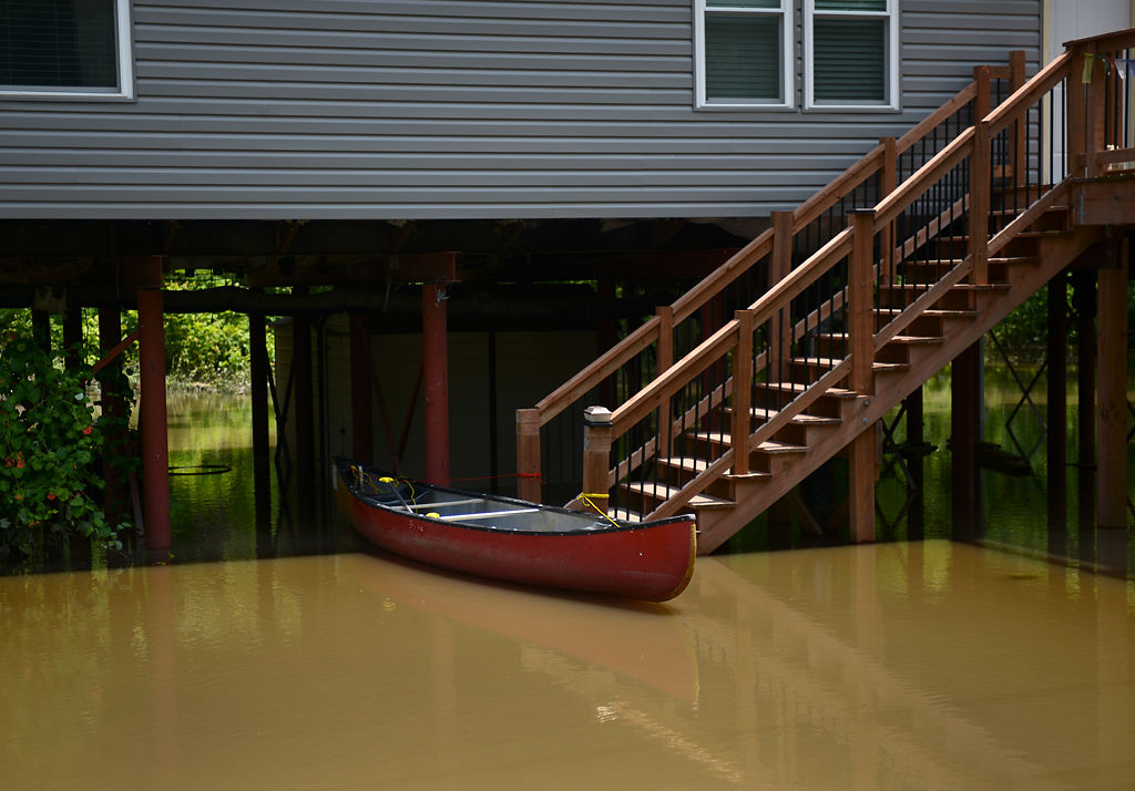 A canoe floats at the base of a staircase
